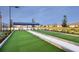 Bocce ball court featuring new turf and seating within a friendly community setting at 18063 Cherished Loop, Bradenton, FL 34211