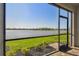 Screened-in lanai overlooking a calm lake at 18063 Cherished Loop, Bradenton, FL 34211