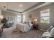 A large and comfortable main bedroom featuring hardwood floors, recessed lighting, and neutral paint at 17126 Savory Mist Cir, Bradenton, FL 34211