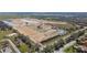 Expansive aerial view of a residential community under construction, highlighting open spaces, ponds, and developing infrastructure at 7556 Nighthawk Dr, Sarasota, FL 34241