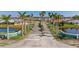 Scenic view of Gulf View Estates entrance, showcasing lush landscaping, palm trees, and peaceful surroundings at 1336 Roosevelt Dr, Venice, FL 34293