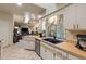 Open-concept kitchen offering wood countertops, stainless steel appliances, and clear sightlines into the living area at 1336 Roosevelt Dr, Venice, FL 34293
