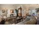 Inviting living room with elegant furnishings, a decorative rug, and seamless flow to the dining area at 1336 Roosevelt Dr, Venice, FL 34293