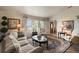 Comfortable living room featuring hardwood floors, natural light, stylish decor, and a welcoming atmosphere at 1336 Roosevelt Dr, Venice, FL 34293