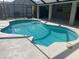 Enjoy the outdoors with this screened-in pool featuring cool blue water and a sun-drenched patio for relaxation at 1336 Roosevelt Dr, Venice, FL 34293