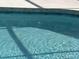 A pristine pool with its shimmering blue water offers a refreshing escape in this inviting outdoor space at 1336 Roosevelt Dr, Venice, FL 34293