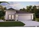 Modern single-story home boasts a two-car garage, neutral color palette, and manicured landscaping at 16890 Fiesta Dr, Port Charlotte, FL 33953