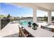 Beautiful outdoor dining and pool area, perfect for relaxing and enjoying backyard views at 1741 Lugano Cir, Nokomis, FL 34275