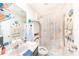 Bright bathroom featuring a stylish under-sea themed shower curtain and decor at 18149 Dillon Ave, Port Charlotte, FL 33954