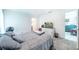 Bedroom features a neutral color palette, plush carpet, and access to an ensuite bathroom at 18149 Dillon Ave, Port Charlotte, FL 33954