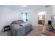 Bedroom boasts plush carpet, neutral tones, and an ensuite bathroom for added privacy at 18149 Dillon Ave, Port Charlotte, FL 33954