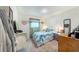 Cozy bedroom with a bright blue and white comforter and matching decor at 18149 Dillon Ave, Port Charlotte, FL 33954