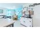 Open dining area with stylish decor, a breakfast nook and a seamless transition to the kitchen at 18149 Dillon Ave, Port Charlotte, FL 33954
