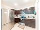 Well-equipped kitchen boasting stainless steel appliances and dark wood cabinetry for ample storage at 18149 Dillon Ave, Port Charlotte, FL 33954