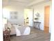 Inviting bedroom featuring a plush bed, wood flooring, and neutral decor at 229 Vistera Blvd, North Venice, FL 34275