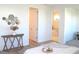 Comfortable bedroom with ensuite bathroom featuring a soaking tub, and wood flooring at 229 Vistera Blvd, North Venice, FL 34275