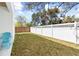 Well-maintained backyard with a pristine lawn and a privacy fence for outdoor enjoyment at 3508 E 11Th Ave, Tampa, FL 33605