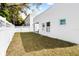 Spacious backyard with lush grass, privacy fence, and room for entertaining at 3508 E 11Th Ave, Tampa, FL 33605
