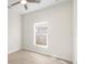 This bright and airy bedroom has lovely vinyl flooring and a sunlit window view at 3508 E 11Th Ave, Tampa, FL 33605