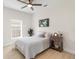 Bright bedroom with ceiling fan, natural light, and charming decor create a cozy space at 3508 E 11Th Ave, Tampa, FL 33605
