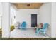 Relaxing covered patio with seating, perfect for outdoor enjoyment and grilling at 3508 E 11Th Ave, Tampa, FL 33605
