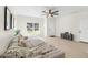 Cozy living room featuring a gray sectional sofa, wood floors and plenty of natural light at 3508 E 11Th Ave, Tampa, FL 33605