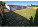 Spacious backyard featuring green grass and wood fence at 3542 Trask Dr, Holiday, FL 34691
