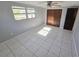 Bright bedroom with large windows, ceiling fan, and neutral color scheme at 3542 Trask Dr, Holiday, FL 34691