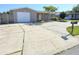 Charming single story home featuring a large driveway, a one car garage, and a well maintained lawn at 3542 Trask Dr, Holiday, FL 34691