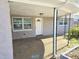 Inviting front porch with a stone facade, offering a cozy entrance to the home at 3542 Trask Dr, Holiday, FL 34691