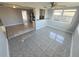 Open-concept living area featuring tiled floors and plenty of natural light at 3542 Trask Dr, Holiday, FL 34691