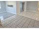 Spacious living room with tile flooring and sliding doors at 3542 Trask Dr, Holiday, FL 34691
