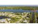 Stunning aerial view of a waterfront home in a community, featuring a beautiful canal and nearby nature trails at 468 Ceil Dr, Nokomis, FL 34275