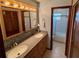 Bathroom showcasing double sink vanity, ample lighting and a stand-up shower at 468 Ceil Dr, Nokomis, FL 34275