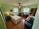 Bright bedroom with hardwood floors, natural light, ceiling fan and functional furniture at 468 Ceil Dr, Nokomis, FL 34275