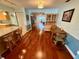 Open dining area with hardwood floors, and access to the living room at 468 Ceil Dr, Nokomis, FL 34275