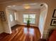 Inviting foyer with gleaming hardwood floors, closet, and bright window at 468 Ceil Dr, Nokomis, FL 34275
