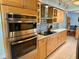 Kitchen with stainless steel appliances, including a double oven and stovetop at 468 Ceil Dr, Nokomis, FL 34275