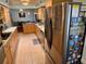 Spacious kitchen with stainless steel refrigerator and an open layout at 468 Ceil Dr, Nokomis, FL 34275