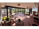 Covered outdoor patio with tropical plants, offering a tranquil space for relaxation at 468 Ceil Dr, Nokomis, FL 34275