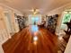 Spacious living room with hardwood floors and natural light, perfect for entertaining at 468 Ceil Dr, Nokomis, FL 34275