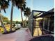 Enjoy evening sunsets from this screened-in patio, offering water views and seamless access to the private dock at 468 Ceil Dr, Nokomis, FL 34275