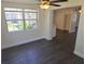 Kitchen with a ceiling fan, lots of light, hardwood floors, and an eat-in area at 4823 Blossom Dr, Holiday, FL 34690