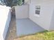 Small concrete patio behind the house at 5014 Galaxy Dr, New Port Richey, FL 34652