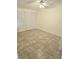Bedroom featuring tile floor, neutral walls and a closet with sliding doors at 5014 Galaxy Dr, New Port Richey, FL 34652