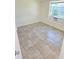 Bedroom featuring tile floor, a window and a window air conditioner at 5014 Galaxy Dr, New Port Richey, FL 34652