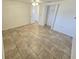Bedroom featuring tile floor, neutral walls and entry to other rooms at 5014 Galaxy Dr, New Port Richey, FL 34652