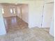 Spacious foyer featuring tile flooring and a front door with decorative glass at 5014 Galaxy Dr, New Port Richey, FL 34652