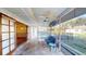 Screened-in porch with seating area overlooking a fenced pool and landscaped yard at 671 Roanoke Rd, Venice, FL 34293