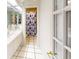 Bright bathroom with double vanity, mirrored walls, and a charming leaf-patterned shower curtain at 671 Roanoke Rd, Venice, FL 34293